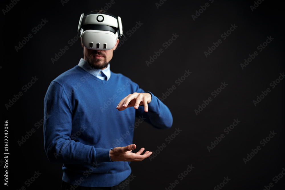 Poster virtual reality experience engages user in creative interaction with technology in dark studio setti
