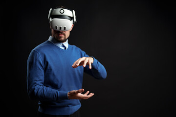 Virtual reality experience engages user in creative interaction with technology in dark studio setting