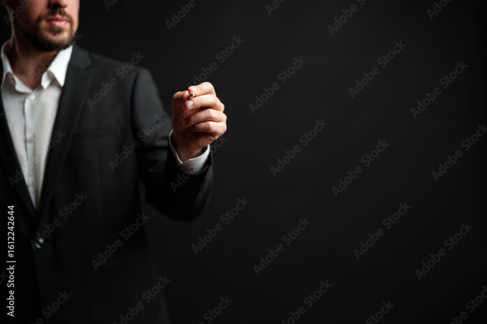Poster hand gesturing signifying a presentation or speech while wearing a suit in a professional setting at