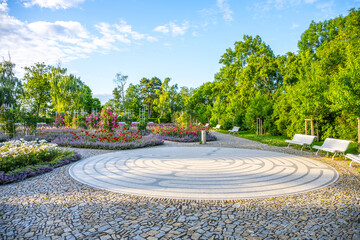 Explore the Rose Garden of Petrin in Prague, where vibrant flowers bloom amidst well-maintained...