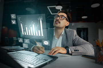 Business professional analyzing data trends in modern office space during daytime