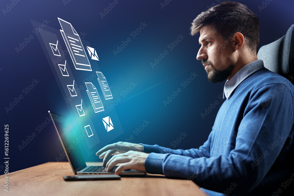 Poster professional man working on a laptop at home while interacting with floating digital documents in a 