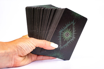 Taro cards in hand. Modern tarot set with vibrant, expressive illustrations for personal and spiritual insight.