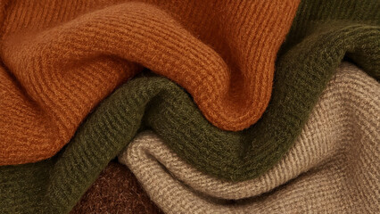 Folded knitted wool fabric in autumn colors