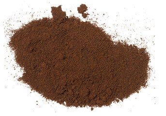 A pile of dark brown finely ground coffee, top view. Coffee is scattered on an isolated background.