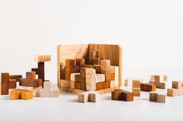 Wooden figures puzzles stacked in a box leisure game