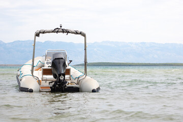 Inflatable Motorboat in Shallow Waters