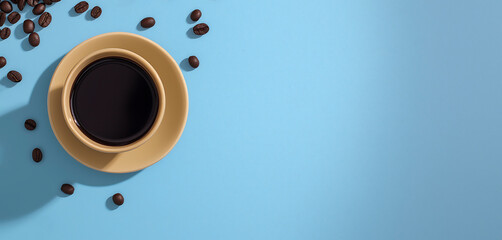 Coffee cup filled with dark brew sits on a yellow saucer, surrounded by scattered coffee beans on a light blue background, creating a vibrant and inviting atmosphere