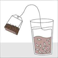 Tea bag steeping in glass of water with herbs and seeds  