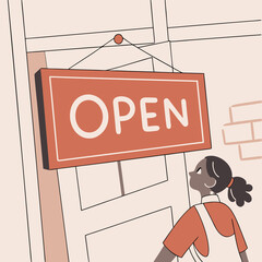 Young woman hanging open sign on door in modern shop interior  
