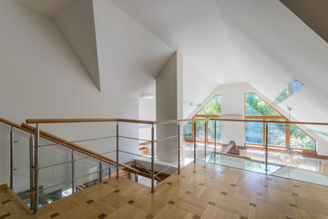 Modern architectural design of a country house. The bright and spacious upper floor features...