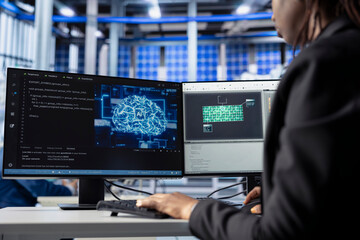 Technician building artificial intelligence solutions in solar panel factory, applying machine learning algorithms to predict errors and automatically adjust production processes