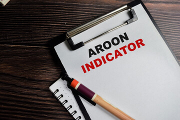 Concept of Aroon indicator write on clipboard isolated on Wooden Table.