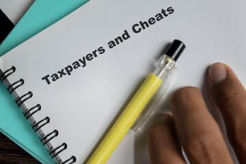 Concept of Taxpayers and cheats write on book isolated on Wooden Table.