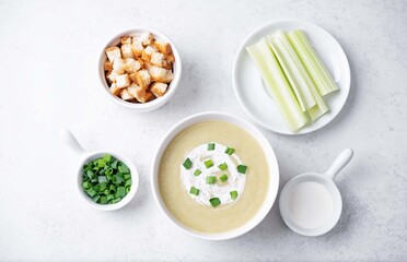 Celery cream soup in a white bowl