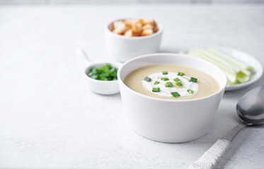 Celery cream soup in a white bowl