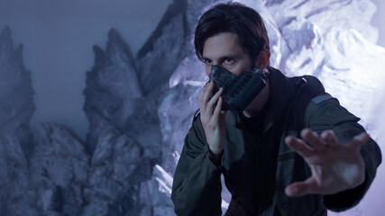 Explorer in protective gear amid glacial rocks, Earth's ice age or extraterrestrial survival concept