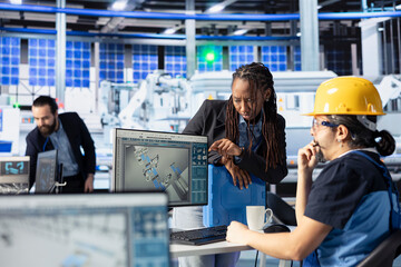Photovoltaics factory employee presenting solar cells designs to manager. Solar panels plant...