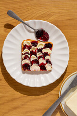 delicious toast with butter and jam creative style on pretty cute plate top view. trendy simple breakfast  