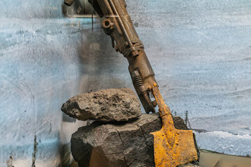 Close-up of a detailed, realistic aircraft carrier model on rugged terrain base, focusing on flight deck and components Even lighting, naturalistic colors gray, blue, yellow No context or people d