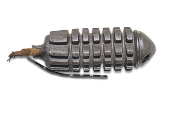 A worn, steel gear resembling a grenade, displayed from above with no surrounding context Even...