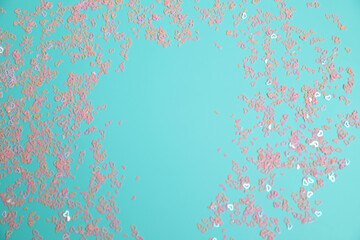 Tiny pink hearts on blue background, love concept