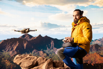 Trekking enthusiast captures his activity on video using a drone footage, documenting the scenic...