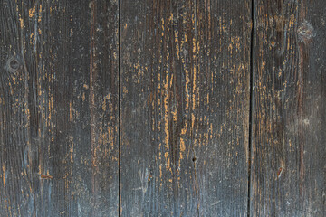 Close-up view of an aged, weathered wooden surface in an ancient Central European village, with...