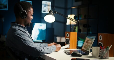 Investor contacting his accountant at home desk to go over current budget balance, boosting...