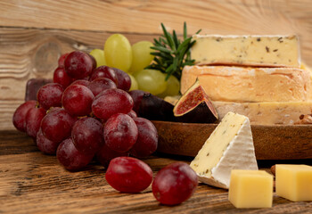 Cheese plate of color cheeses variety, yellow, white and blue cheese board, assorted dairy products