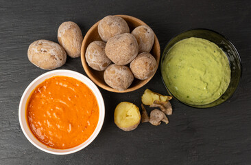 Red mojo rojo and green mojo verde sauces, traditional Tenerife dips, mojo picon dressing