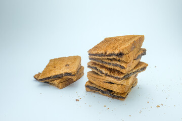 A stack of crispy texture and golden brown color toasted sandwich filled with smooth buttercream...