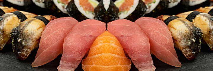 Set of Various Japanese Sushi Food on Dark Sate Plate Closeup. Nigiri and Nori Maki Sushi Rolls