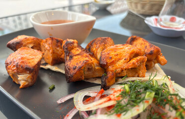 Poultry Shish Kebab, Barbecue Shashlik with Thin Pita Bread and Fresh Vegetables