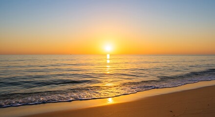 Ocean Sunrise with Golden Reflections on Shoreline Sand and Gentle Waves