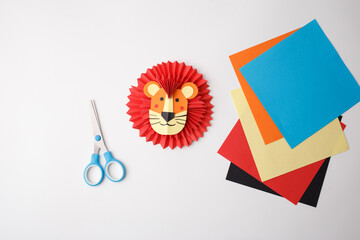 Flat lay lion craft scene for early education platforms, DIY craft shops, children book design, e-learning visuals, parenting influencers, creative kids branding, marketing assets