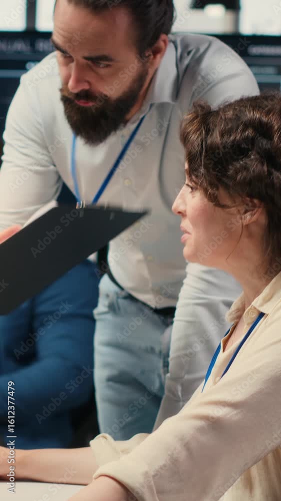 Poster vertical video diverse corporate staff working together on report writing in the office, collaborati