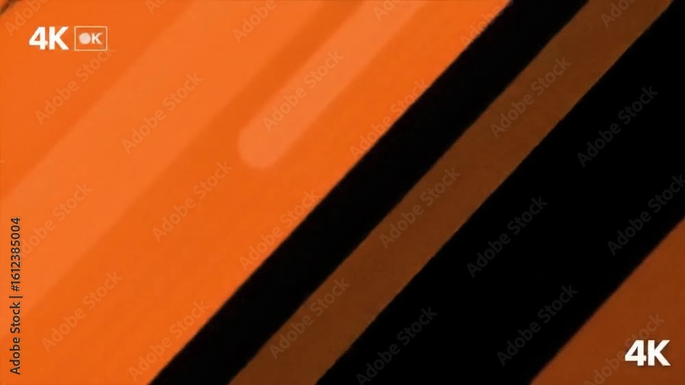 Poster sleek digital display interface with 4k resolution text on a warm, glowing orange backdrop.