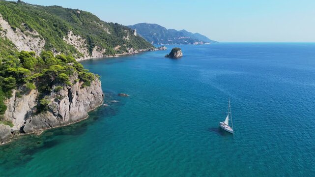 Aerial photo of a yacht boat sailing around Corfu Island, Greece