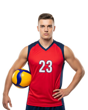 Confident young male athlete in red and blue jersey holding volleyball, studio shot