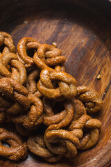 Overhead view of alkaki northern nigerian snack, top view of alkaki snack on a wood countertop, Hausa doughnut made with wheat and sugar paste or honey