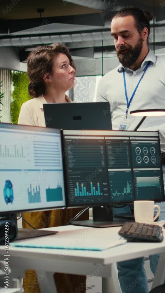 Aufkleber vertical video team of staff members work with high tech and performance metrics, aligning business 