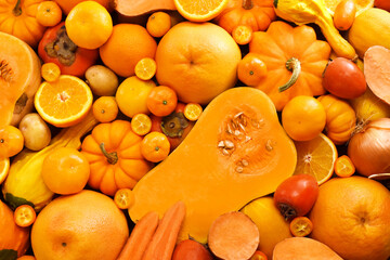 Healthy orange and yellow food high in carotene, fresh ripe bright colorful fruits and vegetables...