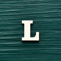 Capital letter L, White letter on a rustic dark green background