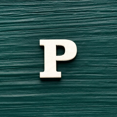 Alphabet letter P, white piece on a dark green rustic background