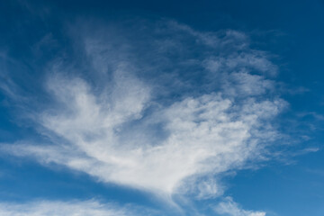 Blue afternoon sky with soft cloud patterms
