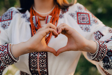 Ukrainian Woman In Traditional Embroidery Vyshyvanka Dress Making Sign Of Shape