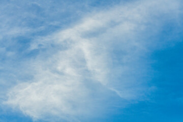 High cloud in the blue afternoon sky