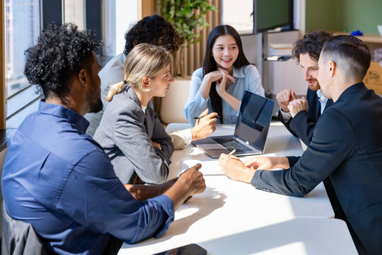 Team of diversity business people are discussing over new strategic strategy project on investment real estate while working in modern office building for new project and planning concept