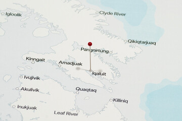 Fototapeta premium red pin needle into Iqaluit city of Canada political map